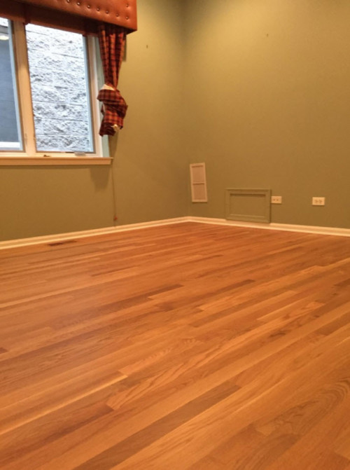 New installation of hardwood floors in a bedroom