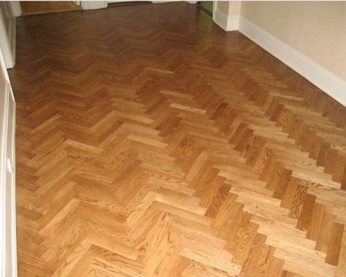 Newly refinished hardwood parquet flooring